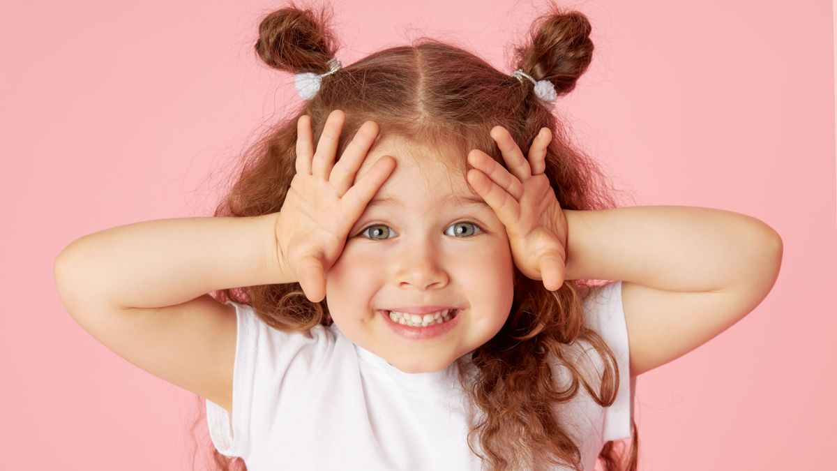 Portrait,Of,Surprised,Cute,Little,Toddler,Girl,Child,Over,Pink